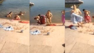 Indian village women bathing topless in pond